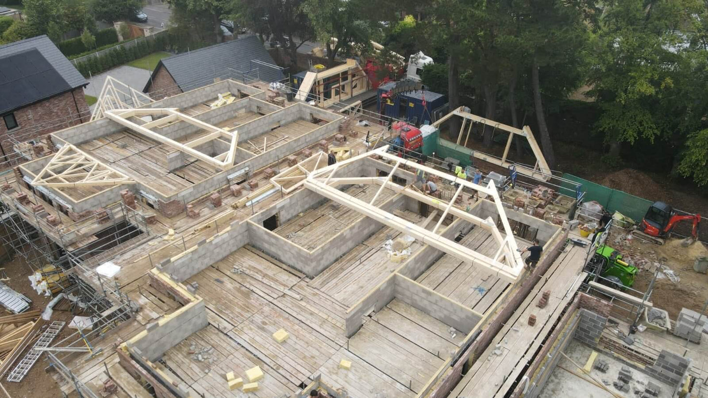 attic trusses laid flat on a building site