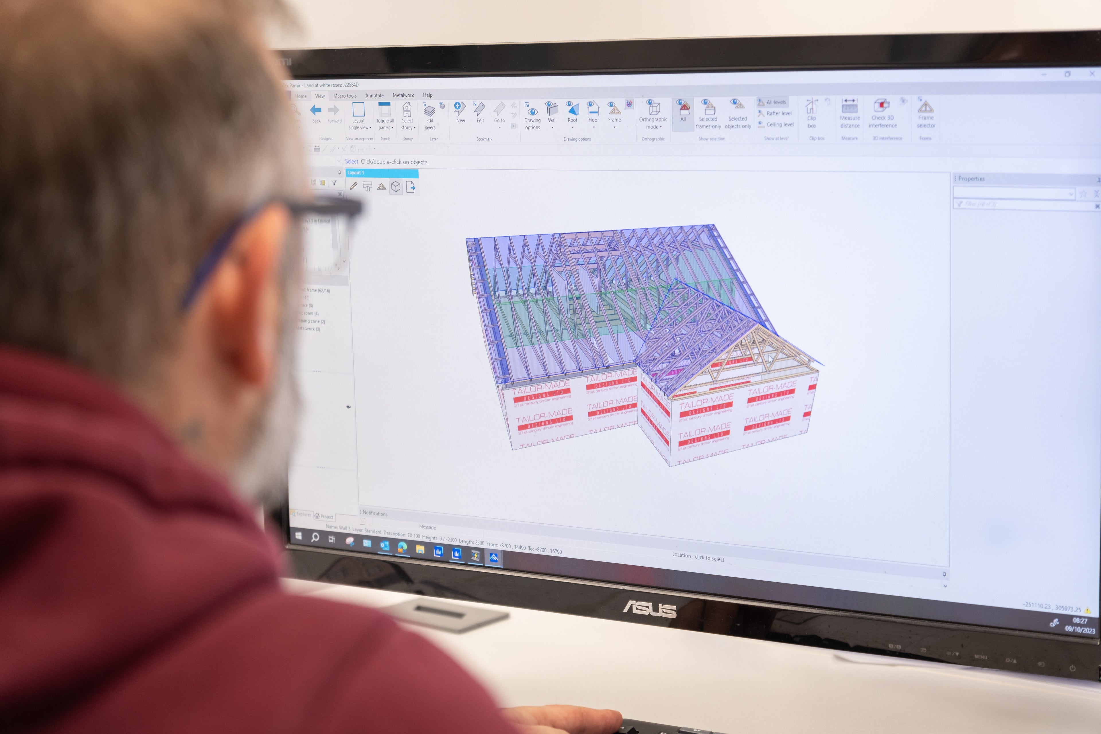 a man designing roof trusses on a computer