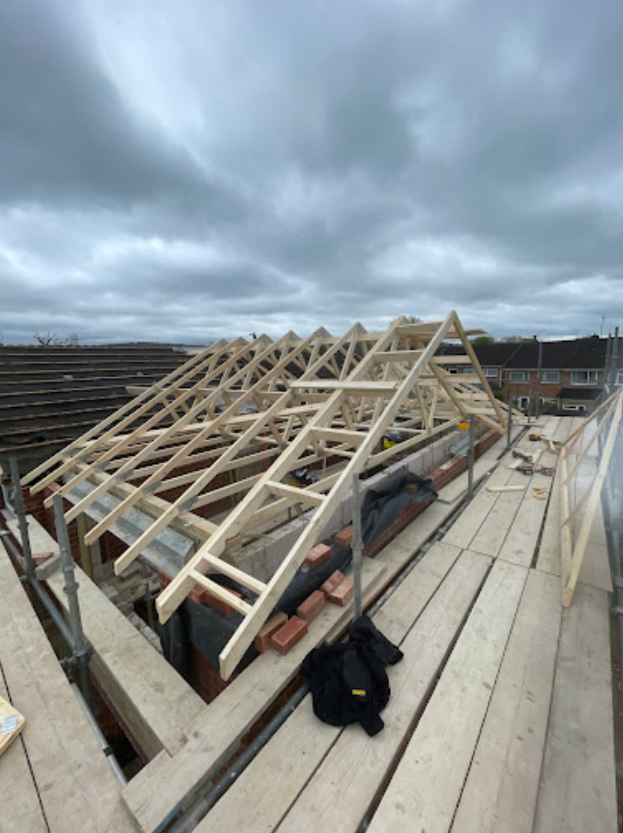 roof trusses being installed on a home